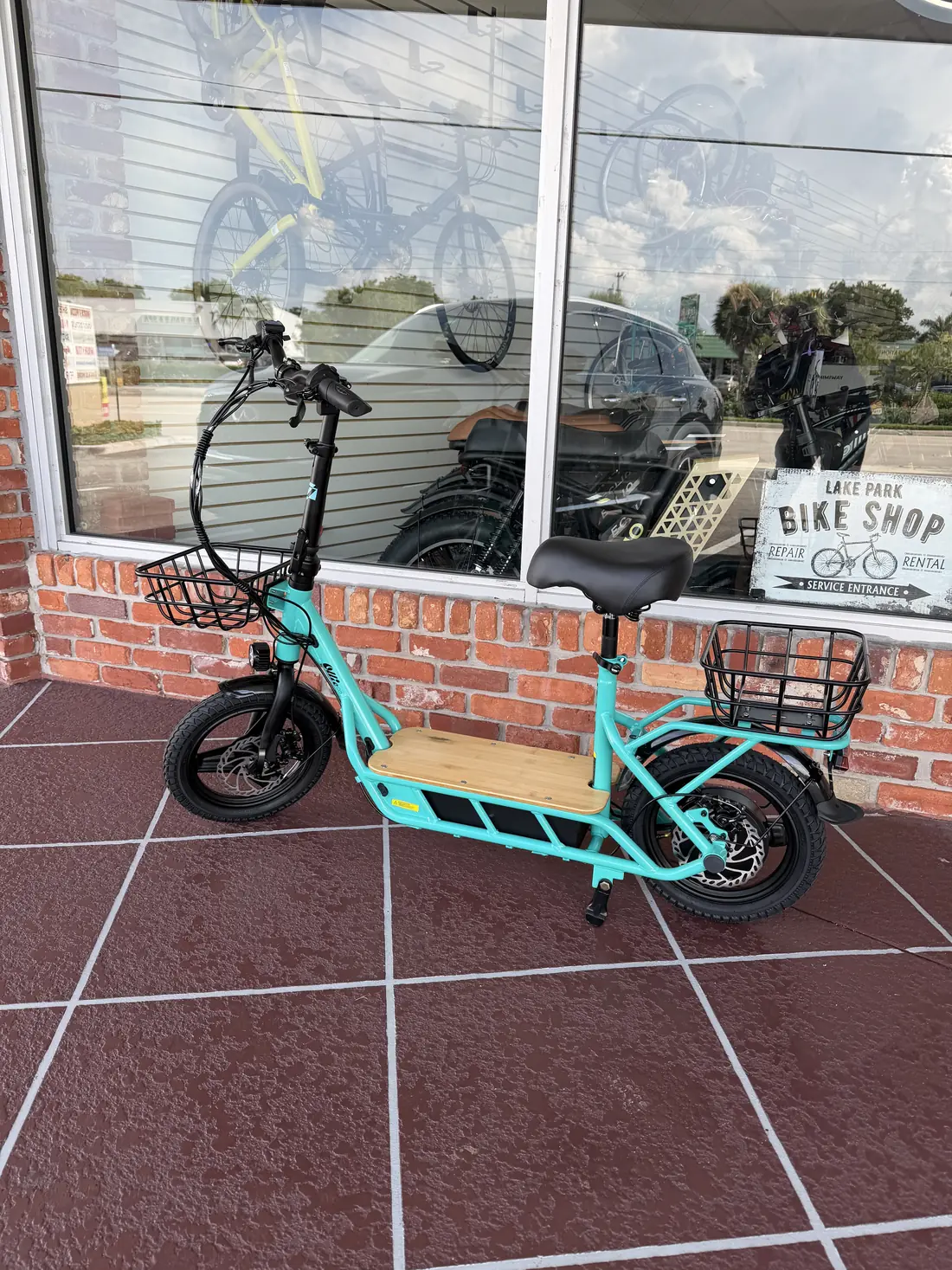 Electric scooter outside the shop window