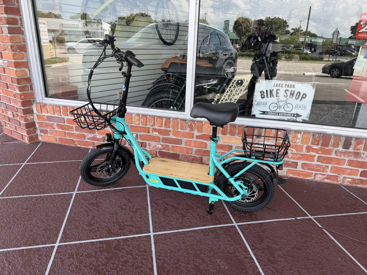 Seated electric scooter outside Lake Park Bicycles