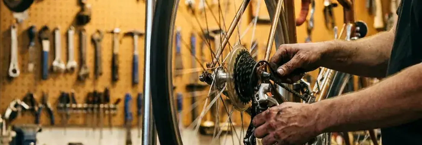 Tony adjusting a rear derailleur on the repair stand
